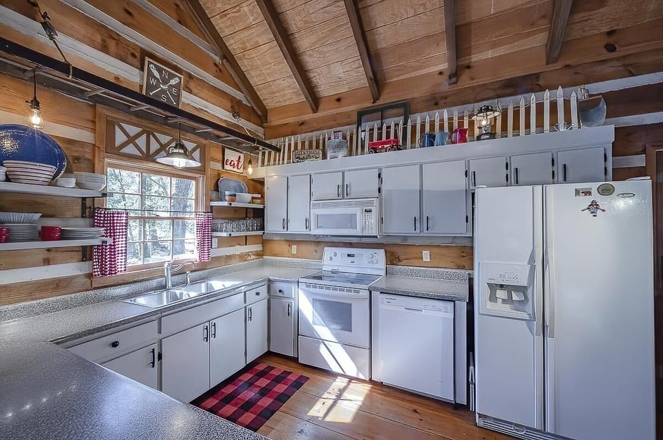 Well stocked kitchen with dishwasher, microwave, stove/oven and fridge
