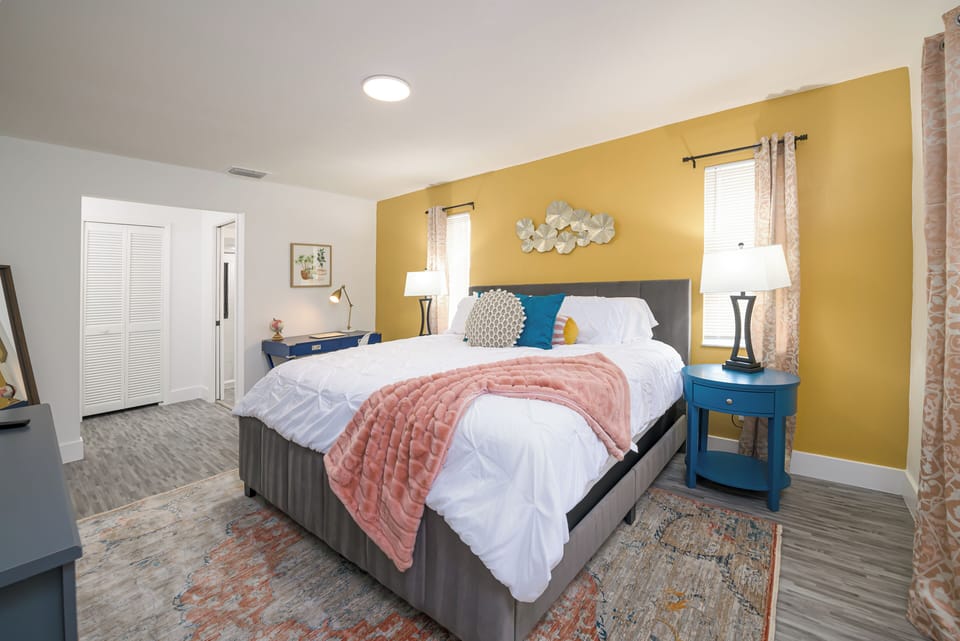 Bedroom 1. King Bed with en suite bathroom and desk.  Pack n play and high chair are also in the closet. Sleeps 2!