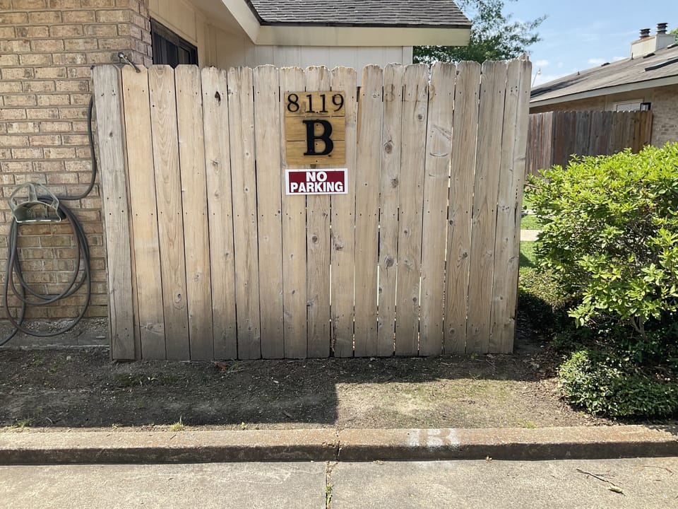 Two reserved parking spaces just feet from the front door 