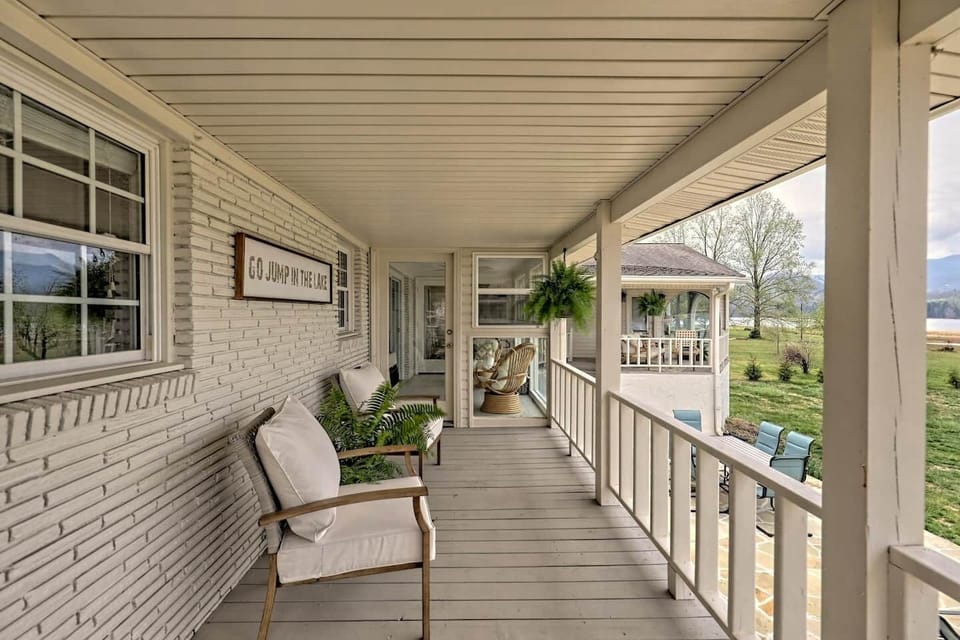 A wonderful back porch that overlooks the fire pit, lake and dock