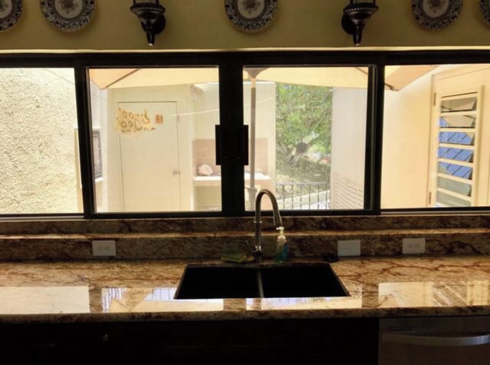 kitchen window with view to upper veranda