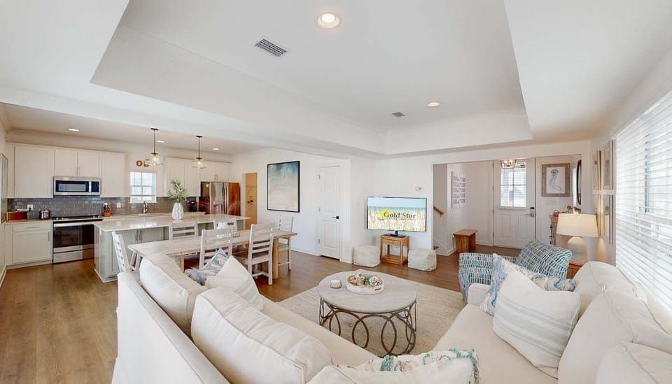 The seamless integration of the main living areas of the home creates a comfortable, spacious atmosphere to relax and unwind together.