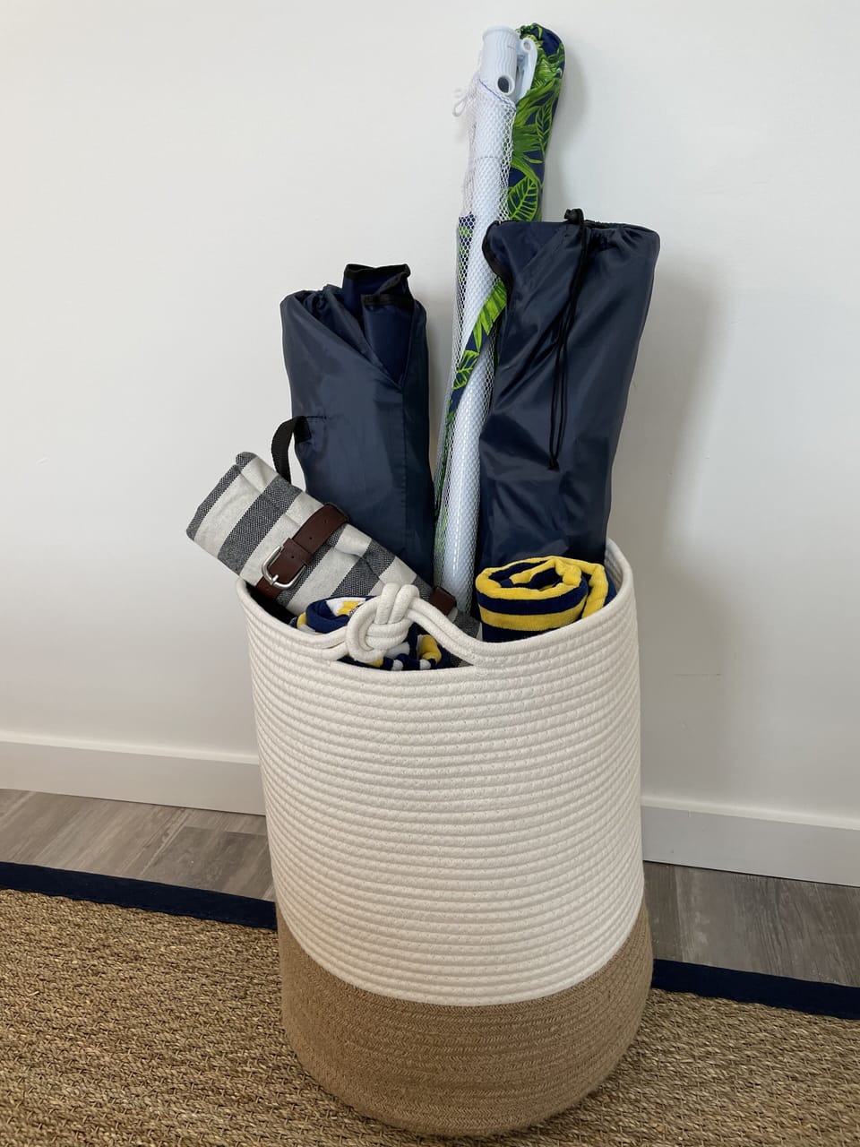 Beach umbrella, towels, blanket, and chairs
