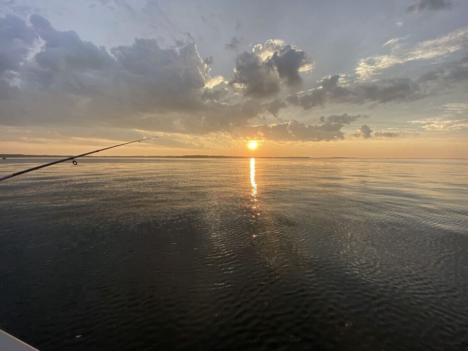 Sunset fishing on Mille Lacs Lake, cabin includes a protected 44` boat dock
