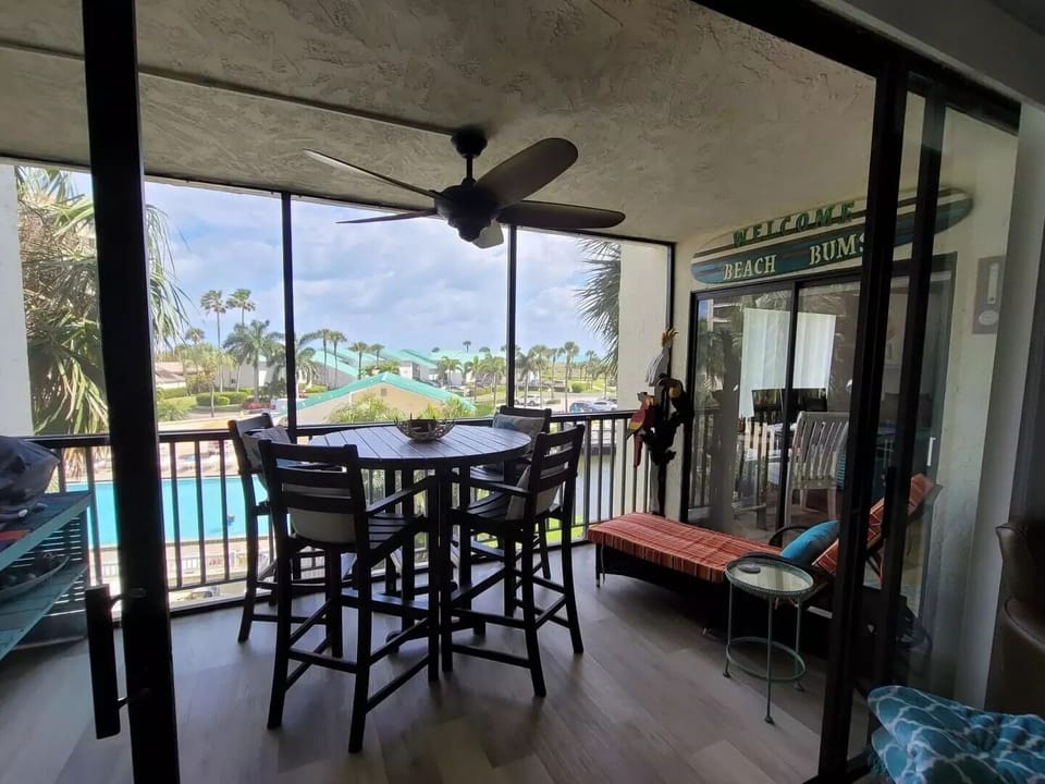 Lanai overlooking Cayman swimming pool with ocean views 