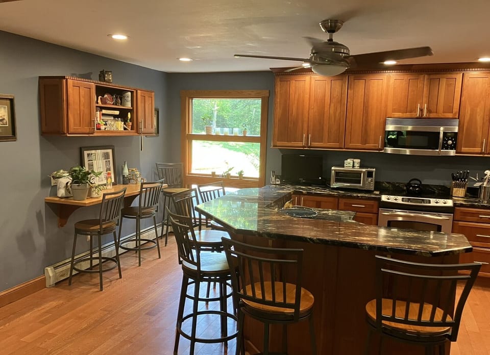 Kitchen view 2: desk and large window to front yard