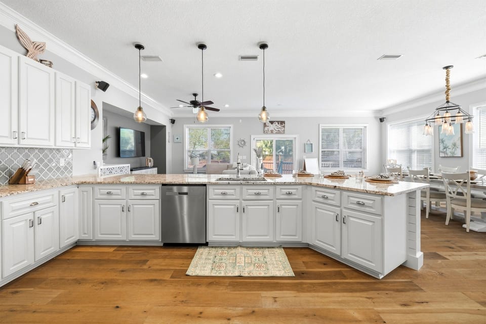 Spacious layout with seating, prep space, and natural light — the heart of the home for meals and memory-making.