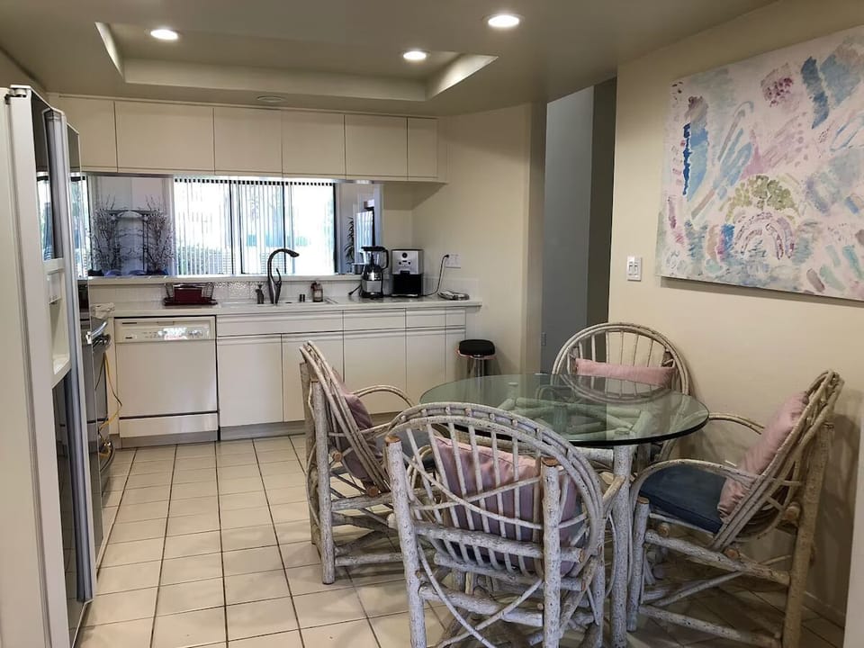 There's plenty of seating space in the living area, kitchen, and the den.