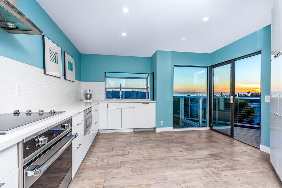 Sliding glass doors open from kitchen to balcony
