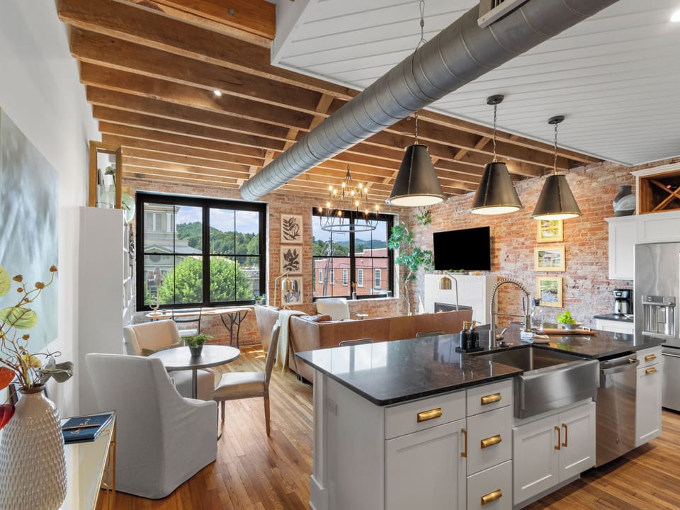 View of the open kitchen and living room from the hallway