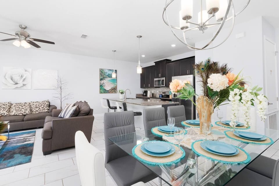 Enjoy the well decorated living room and dinning table with seating for 8. In addition to 4 bar chairs..