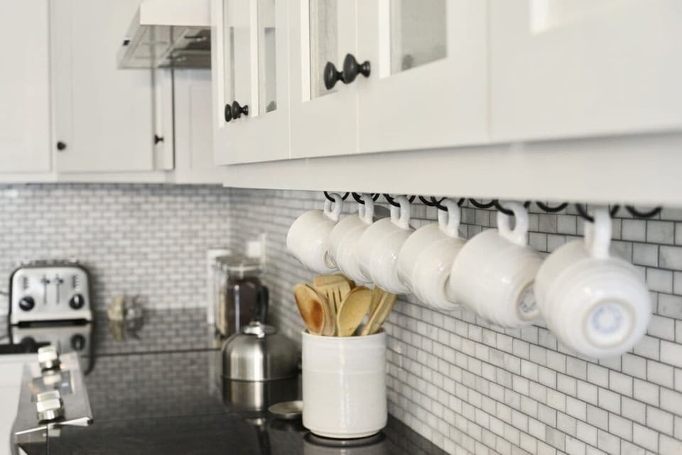 Kitchen is stocked w/ dishes, silverware, cooking utensils and pots/pans. 