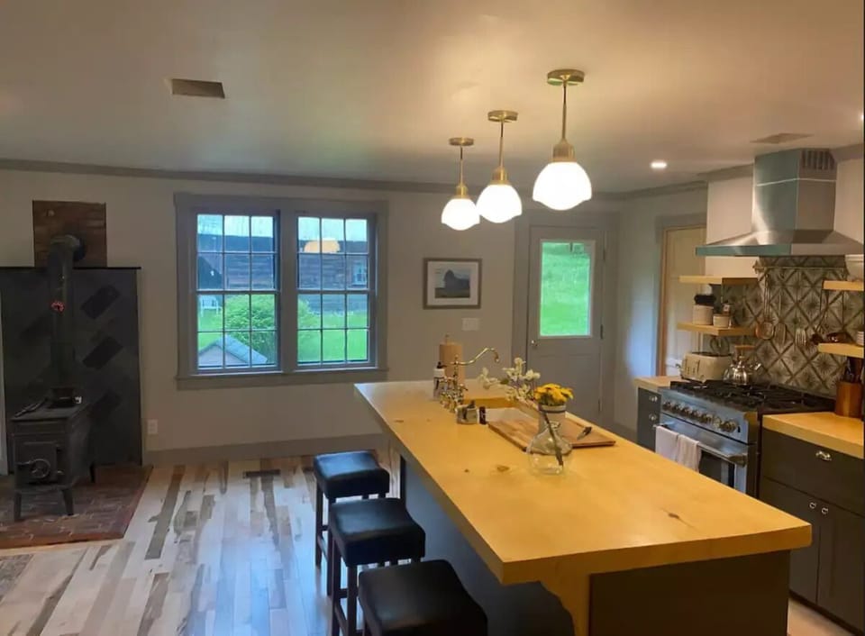 Kitchen with side door leading to backyard and outdoor patio