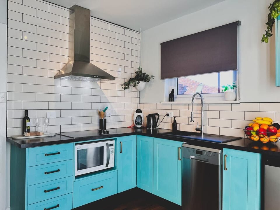 Full kitchen with microwave/oven, cooktop and rangehood