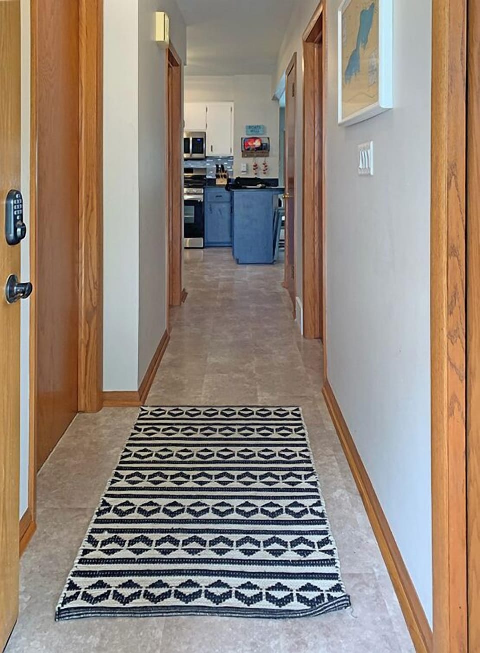 Main entrance hallway––bedroom, laundry and half bathroom access.