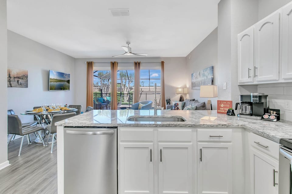 Watch pool fun while cooking in fully-equipped kitchen. Vacation time, have fun!