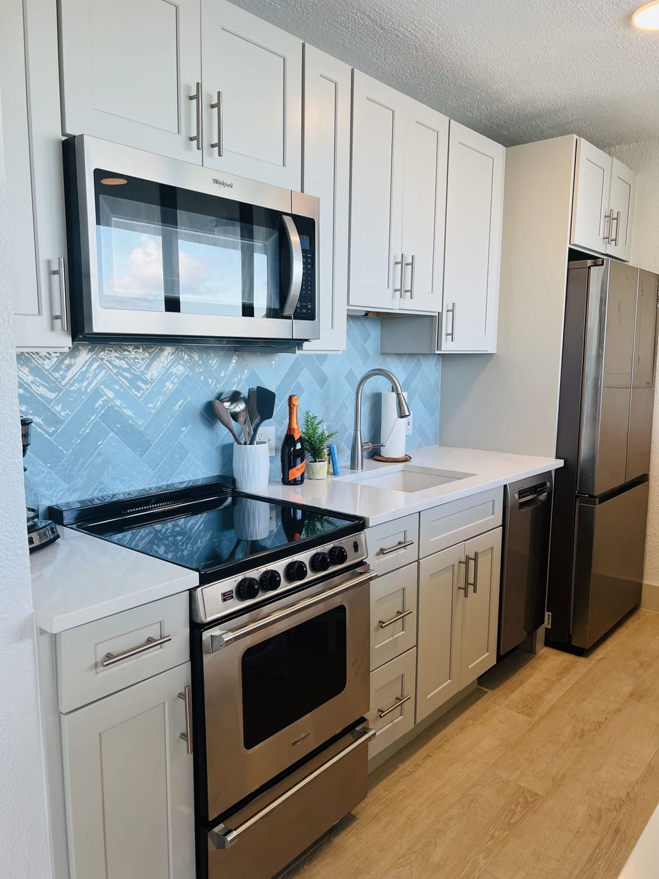 Fully stocked Kitchen with dishwasher plus bar seating facing the Ocean