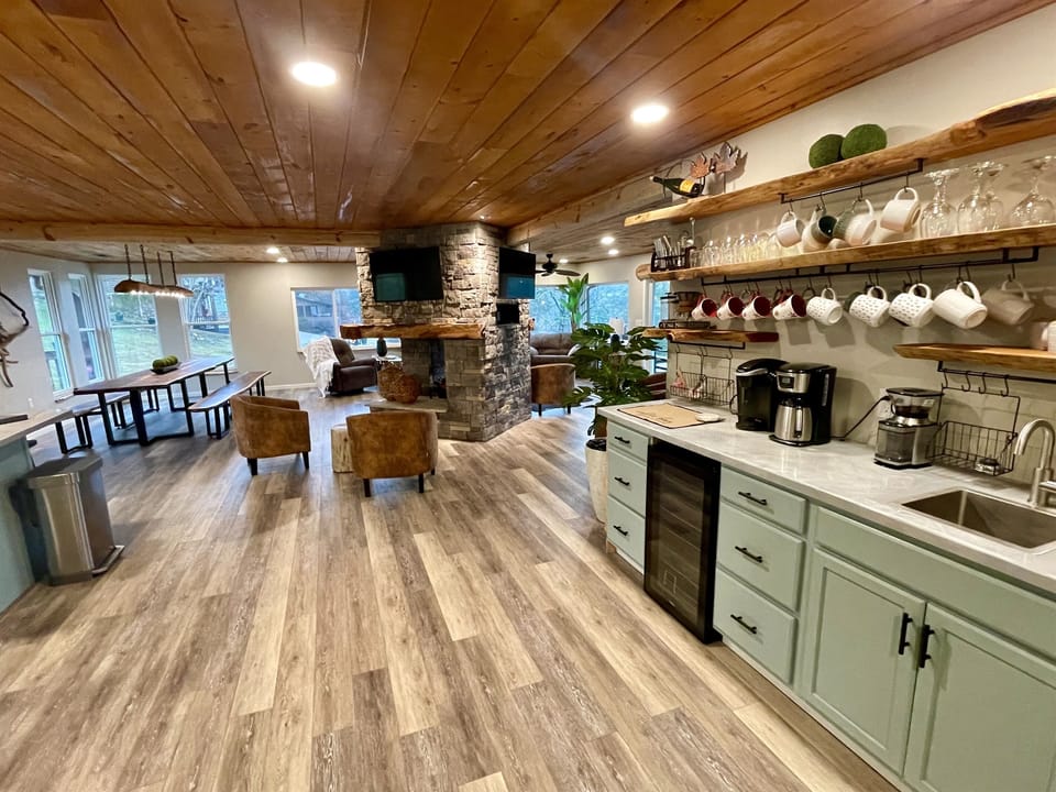 Coffee bar with every way to make coffee that you want. 12 cup brew, coffee bean grinder full of beans, keurig machine, pour over, French press.