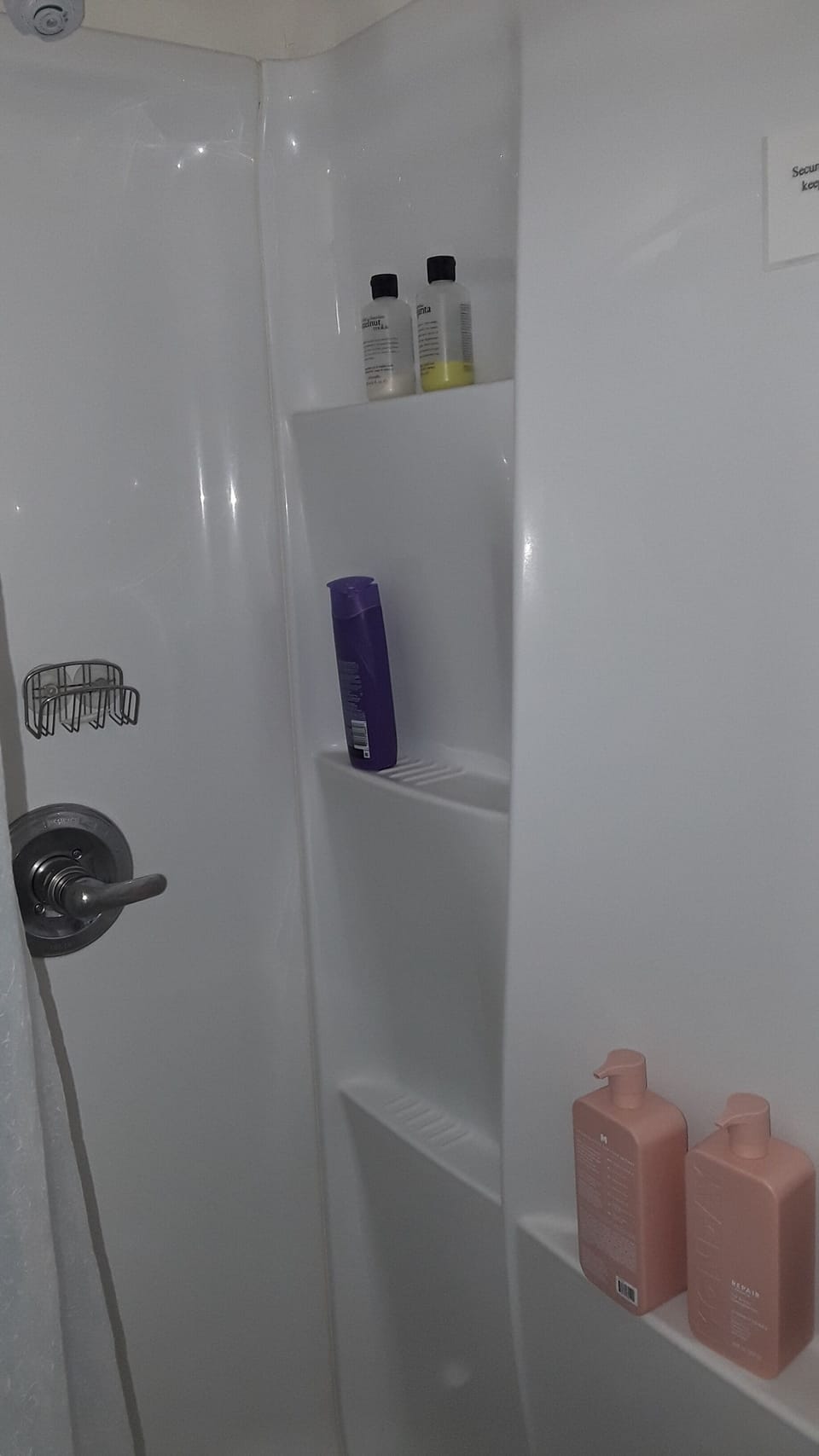 Shower with shampoo and bath soap.