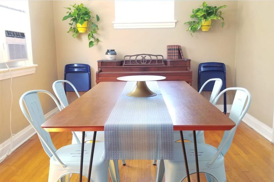 Side B: Dining room table, with a piano for a little music. (1st Floor)