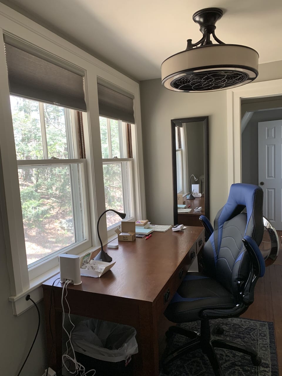 Office on 2nd fl has desk, chair, bookshelves, and view of Laurel Hill forest
