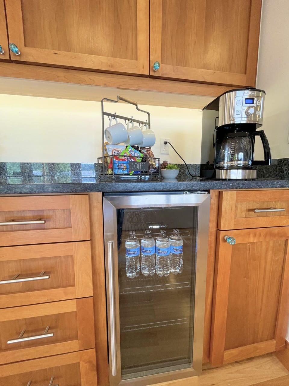 Complimentary snack, water, and coffee bar 