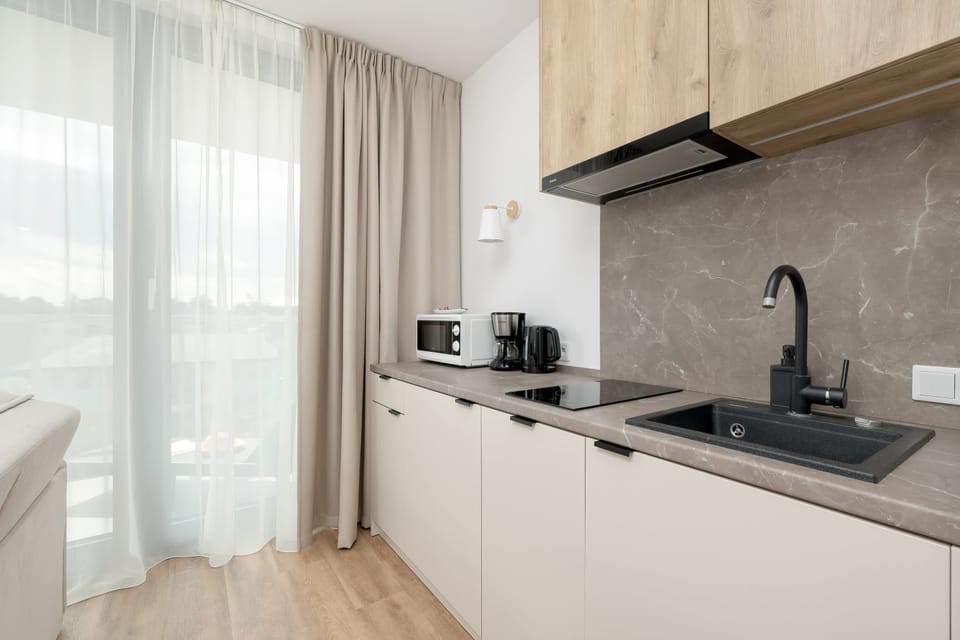 The fully equipped kitchenette includes everything you need for a home-cooked meal.