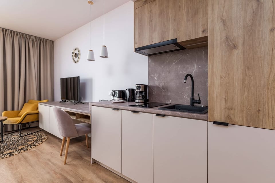Cook and dine in style with the modern kitchenette and dining area.