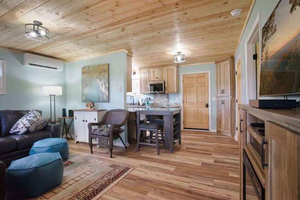 Another view of the front door and living/dining area.