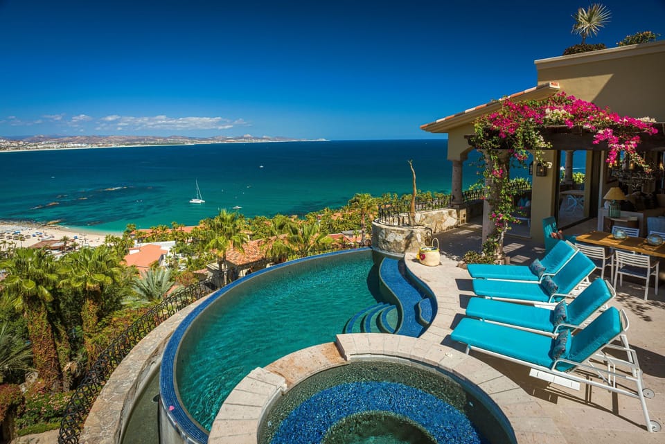 Infinity pool and hot tub with ocean and mountain views!