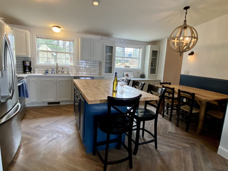 Countertop seating as well as a dining room table in the kitchen