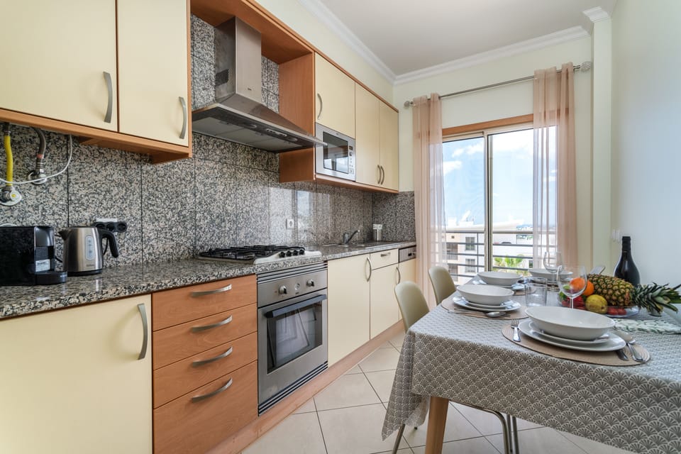 The kitchen is equipped with all necessary appliances: fridge, microwave, oven. 