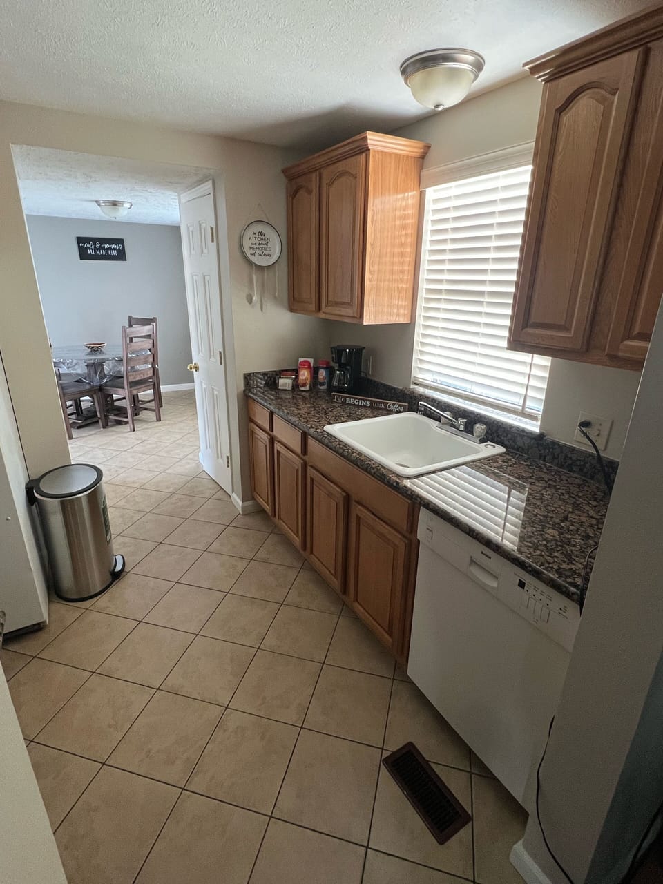 Kitchen with a fridge, dishwasher, stove and microwave 