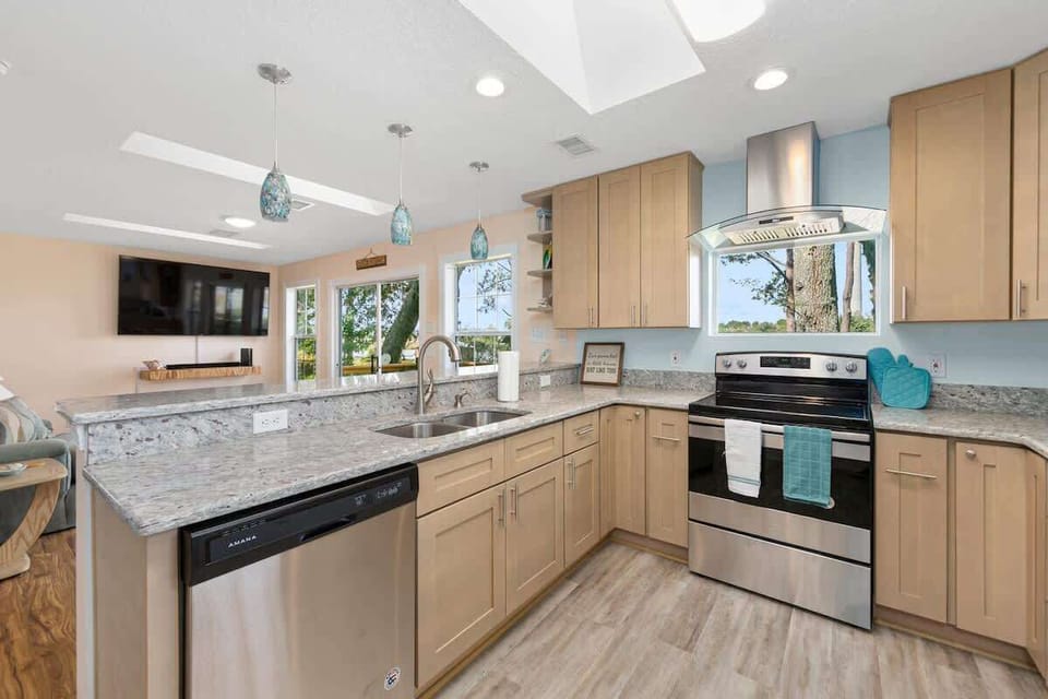Stocked kitchen with stowed away Keurig, microwave and French door refrigerator