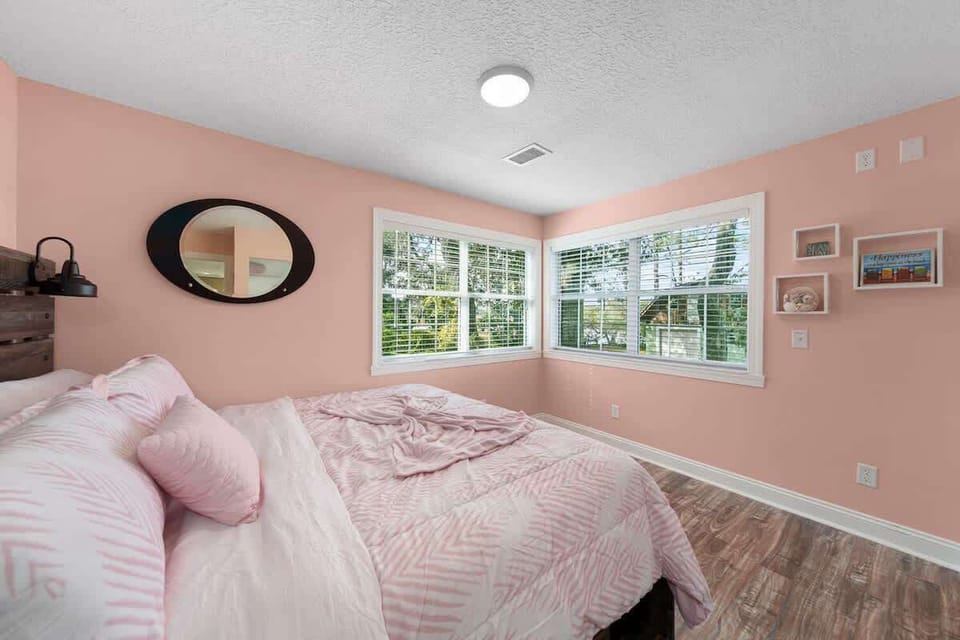 Master Bedroom - King Bed w/ storage underneath.  During Sunset, the sun pours through these two windows to flood the space with natural light!