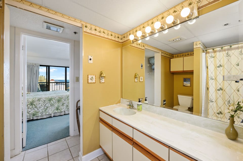 The Primary Bedroom shares a Jack and Jill bath that’s brightly lit and equipped with spacious counterspace