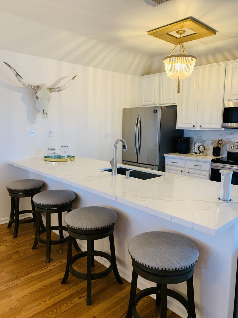 Eating area with 4 barstools.