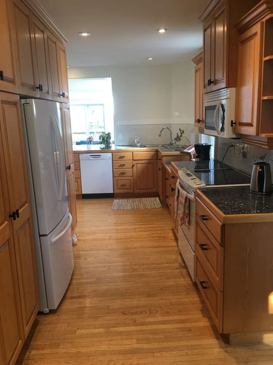 Galley kitchen - well equipped with essential kitchen appliances.