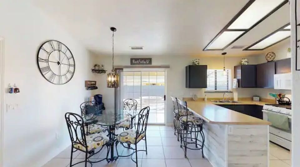 View of kitchen and dining area from living room. Space is open concept living! 