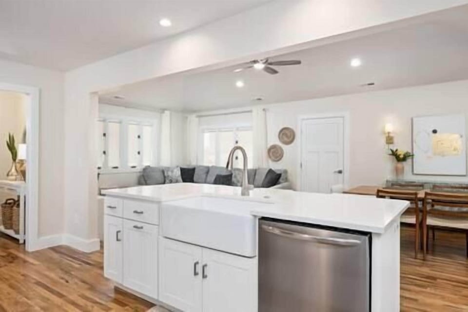 Main living area viewed from kitchen with front entrance to the left