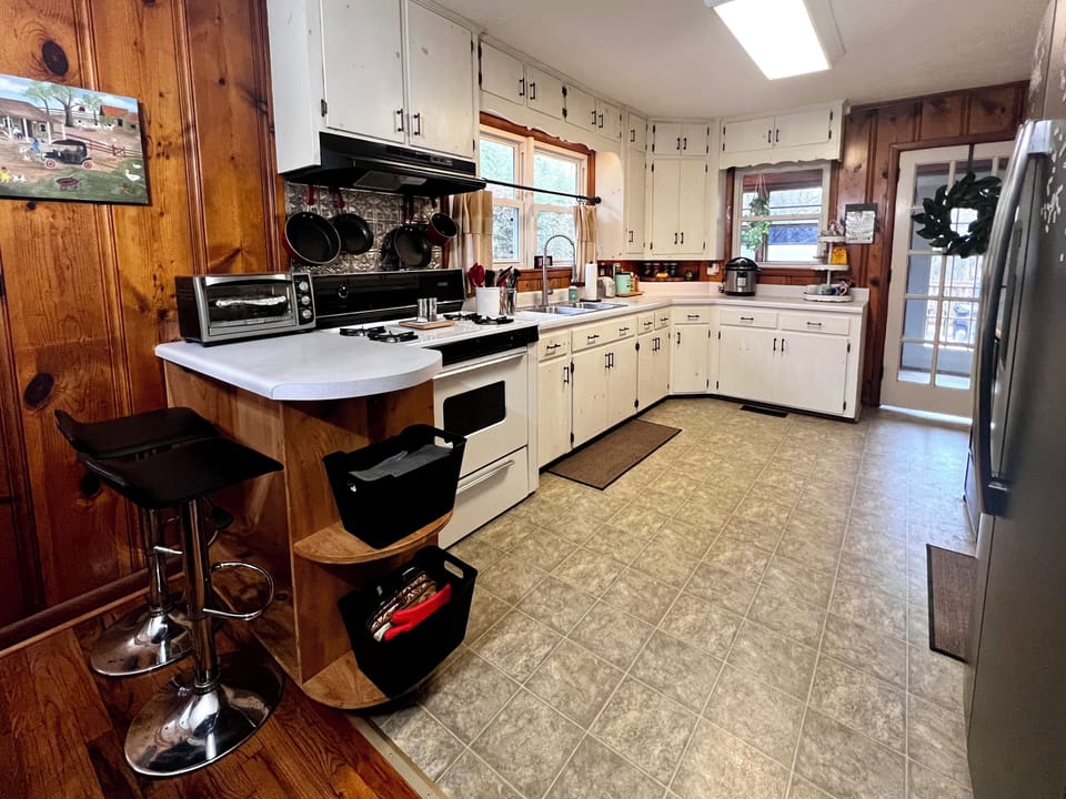 Full kitchen with everything you need plus 2 extra seats at the bar