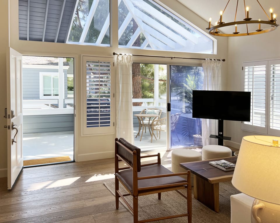 Light-filled living room looks out onto a comfortable patio!