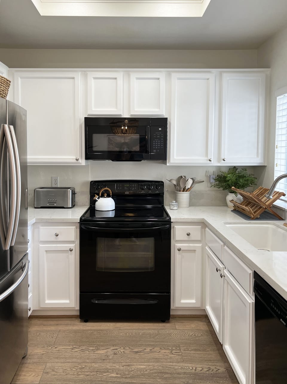 Kitchen equipped with dishware, serveware, and cookware. Ready for you to use!