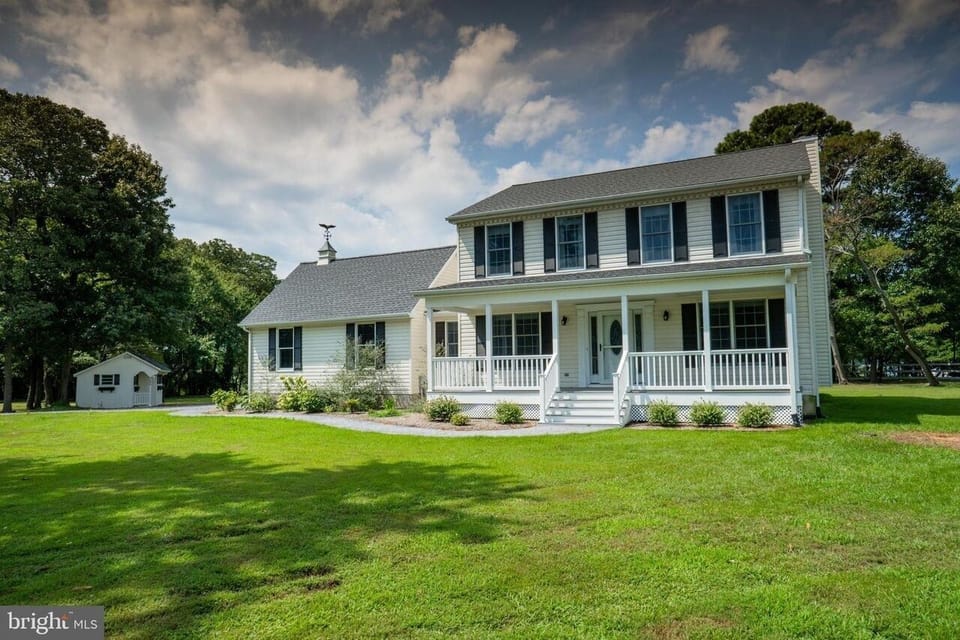 Front of house showing our welcoming  covered porch 