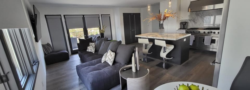 Living room area with 85 inch Smart TV
