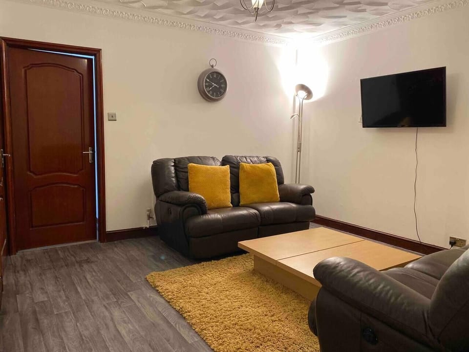 Whether you're catching up on work, spending a quiet evening in, or sharing the space with a loved one, the relaxed atmosphere and stylish touches make this living area a truly welcoming spot.