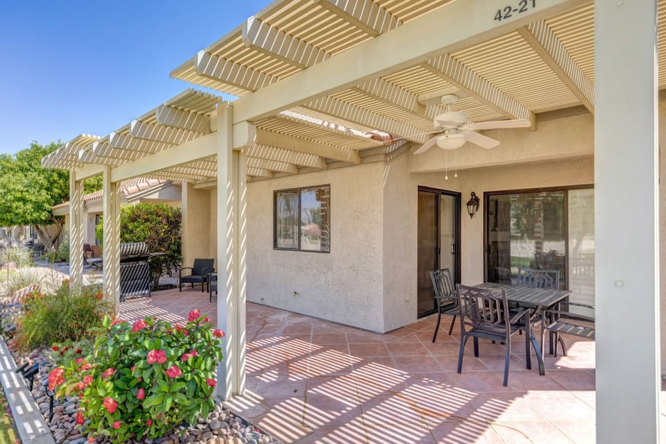 Back patio w/ grill, dining table and extra seating (not shown) 