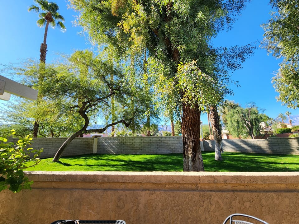 Corner Lot with Large communal grass area.