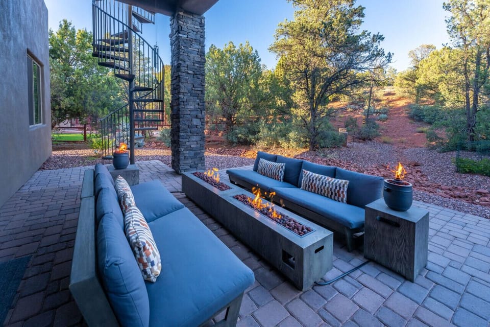 Rear covered patio, seating, fire feature and dining.