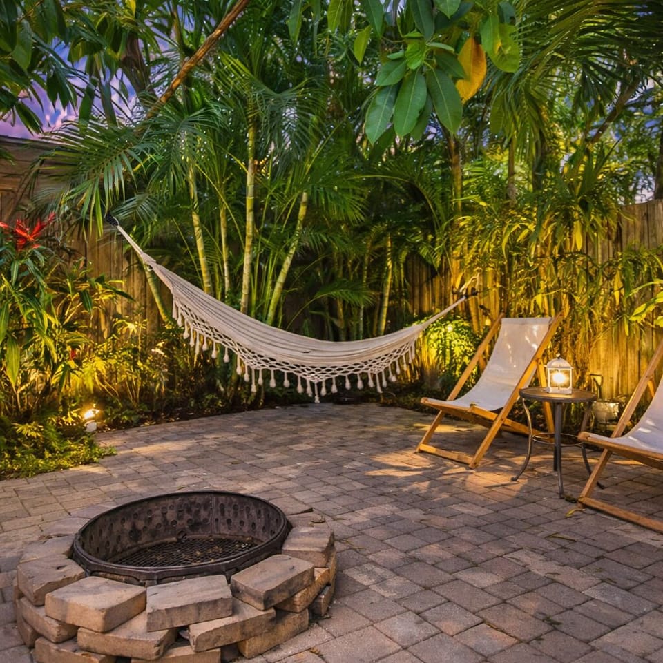Unwind under the palms in your own tropical hideaway—hammock, fire pit, and pure evening serenity. 🌴🔥✨